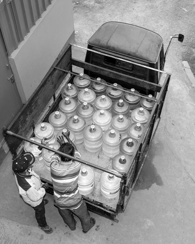 A batch of packaged safe drinking water jars being loaded for home delivery at Sulabh plant in Madhusudankati village, North 24 Parganas district, West Bengal